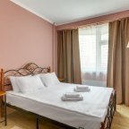 Кровать номера Люкс с джакузи в отеле Фортуна Бест