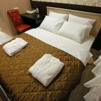 Двуспальная кровать в номере Эконом в Elysium hotel