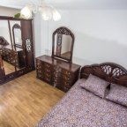 Кровать в номере 1 в апартаментах Коломенская
