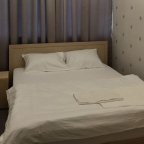 Спальная зона в номере Эконом в отеле L&G в Раменках