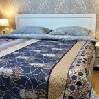 Спальная зона в номере Делюкс в отеле Flori Hotel