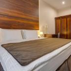 Спальное место в номере Улучшенный в отеле Viewpoint Hotel