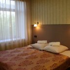 Кровать в номере Стандарт в отеле Зима