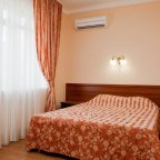 Кровать в номере Стандарт эконом в отеле MALDINI SPA