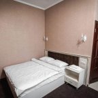 Кровать в номере Стандарт в отеле Кураж