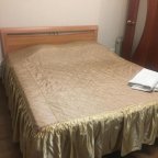 Кровать в номере  2 в отеле EURO сауна