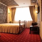 Двуспальная кровать в номере Бизнес-Комфорт в отеле Дюна