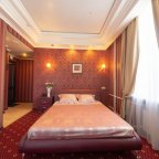 Кровать в номере Junior Suite в отеле Троя