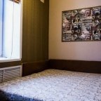 Кровать в номере Двухместный с сауной и джакузи в отеле Мираж
