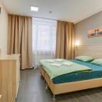 Кровать в номере Улучшенный Стандарт в отеле Ладомир на Каховке