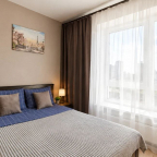 Кровать в номере New studio na Larushina в The LOFT STUDIO Moscow