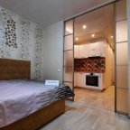 Кровать в апартаментах 4 в Loft Studio