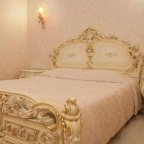 Кровать в номере Делюкс в Брестоле