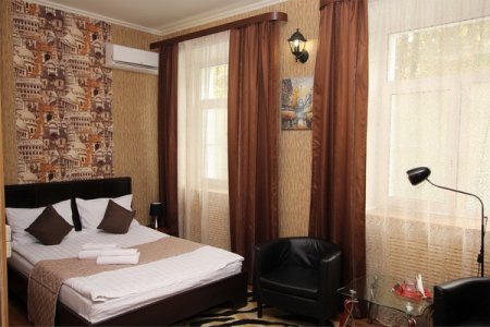 Кровать в номере Стандарт в отеле Лефортовский дворик