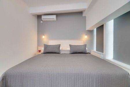 Двуспальная кровать в номере Бизнес отеля Минима Аэропорт