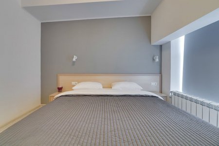 Двуспальная кровать в номере Комфорт в отеле Минима Аэропорт