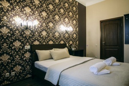 Кровать в номере Стандартный двухместный в гостевом доме Sellingroom