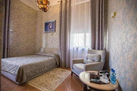 Интерьер номера  Делюкс в отеле Зодиак