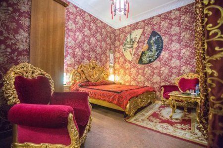 Кровать в номере Люкс в отеле Зодиак