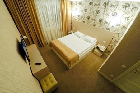 Кровать в номере Комфорт в отеле Инвайт Марьино
