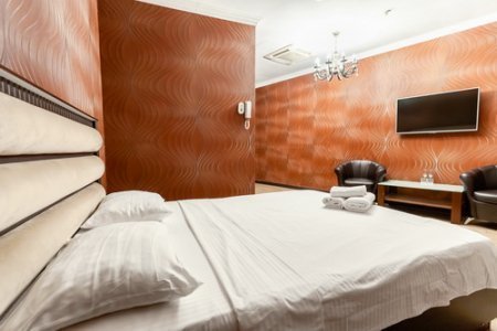 Кровать номера 203 Комфорт в отеле De Art на Профсоюзной