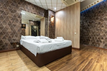 Кровать в номере 215 Делюкс - De Art на Профсоюзной