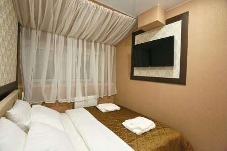 Большая кровать в номере Эконом в Elysium hotel