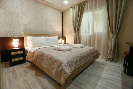 Спальная зона в номере Комфорт в отеле Elysium hotel