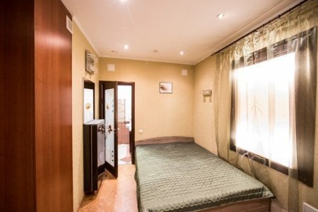 Кровать в номере Люкс 2-х комнатный в отеле Ладомир на Яузе