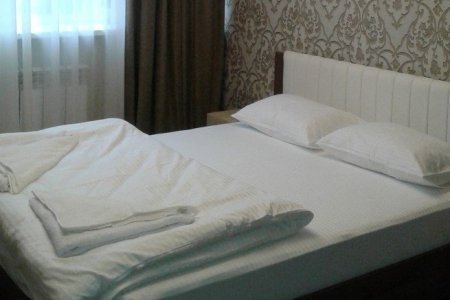 Отель L&G метро Минская на пару часов Кровать в номере Полулюкс в отеле L&G в Раменках