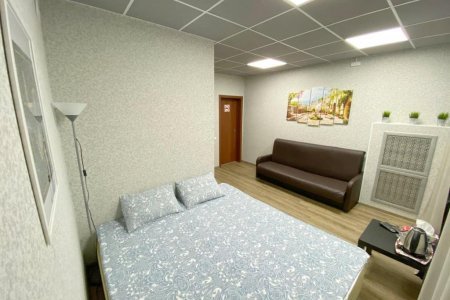 Кровать в номере Делюкс в отеле Стромынка