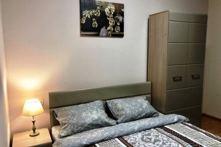 Двуспальная кровать в номере Делюкс в отеле Flori Hotel