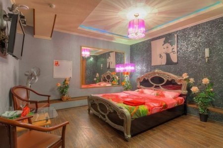 Кровать в номере 4 в отеле Дионис