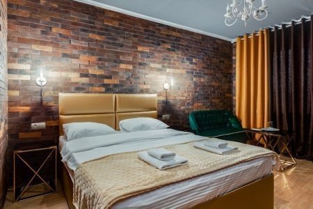 Кровать в номере 10 Loft большой в отеле Renvills Hotel