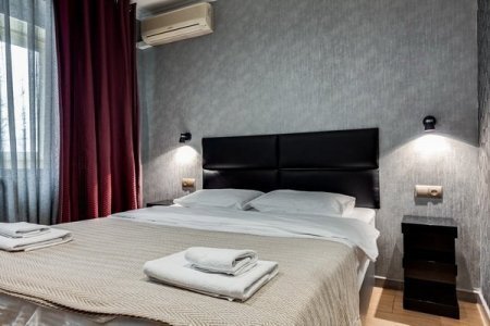 Кровать в номере 4 в отеле Renvills Hotel