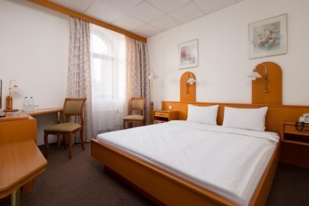 Кровать в номере Стандарт в отеле ТрансОтель