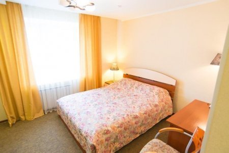 Кровать в номере DBL в отеле Suite Hotel