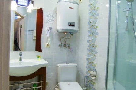 Санузел в номере DBL Улучшенный в отеле Suite Hotel