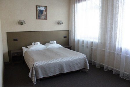Кровать в номере Стандарт Улучшенный в отеле Зима