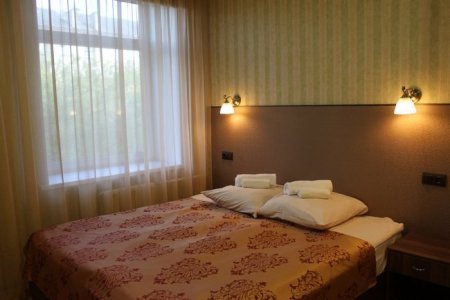 Кровать в номере Стандарт в отеле Зима