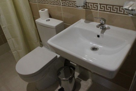 Раковина в номере Стандарт Улучшенный в отеле Зима