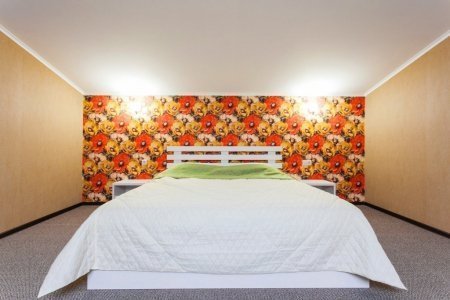 Кровать в номере Люкс в отеле Олива 