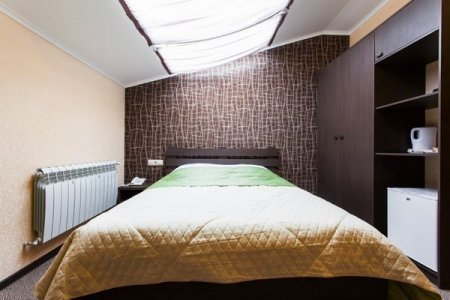 Спальная зона номера Бюджетный в отеле Олива
