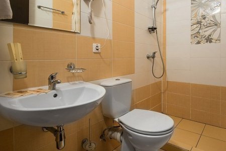Санузел в номере Стандарт плюс в отеле Атлас