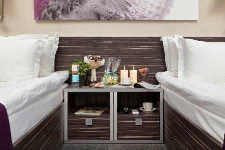 Тумбочки в номере Стандарт в отеле City Hotel Sova