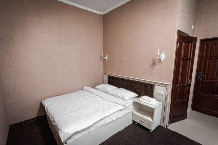 Кровать в номере Стандарт в отеле Кураж