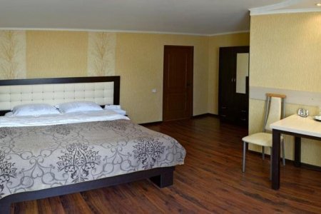 Кровать в номере Стандарт в отеле Парадис
