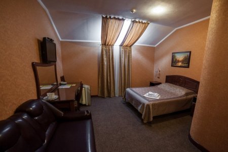 Кровать в номере Стандарт в отеле Старый Ростов