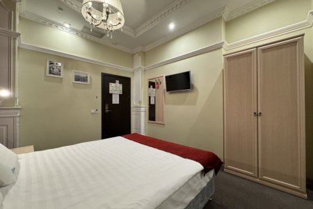 Кровать в номере Стандарт 102 в отеле Гипноз на Дмитровке