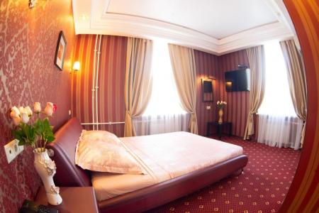 Спальная зона в номере Junior Suite в отеле Троя